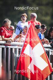 26.08.2022, Ruhpolding, Germany (GER): Event Feature: Flag of Switzerland held by spectators - IBU Summer Biathlon World Championships, super sprint men, Ruhpolding (GER). www.nordicfocus.com. © Manzoni/NordicFocus. Every downloaded picture is fee-liable.