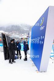 14.12.2022, Annecy-Le Grand Bornand, France (FRA): Event Feature: Infront technicians use the startgate as a rain shelter- IBU World Cup Biathlon, training, Annecy-Le Grand Bornand (FRA). www.nordicfocus.com. © Manzoni/NordicFocus. Every downloaded picture is fee-liable.