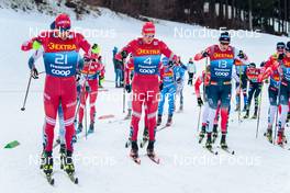 03.01.2022, Val di Fiemme, Italy (ITA): Alexey Chervotkin (RUS), Alexander Bolshunov (RUS), Martin Loewstroem Nyenget (NOR), (l-r)  - FIS world cup cross-country, tour de ski, mass men, Val di Fiemme (ITA). www.nordicfocus.com. © Modica/NordicFocus. Every downloaded picture is fee-liable.