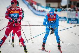 03.01.2022, Val di Fiemme, Italy (ITA): Andrey Melnichenko (RUS), Federico Pellegrino (ITA), (l-r)  - FIS world cup cross-country, tour de ski, mass men, Val di Fiemme (ITA). www.nordicfocus.com. © Modica/NordicFocus. Every downloaded picture is fee-liable.