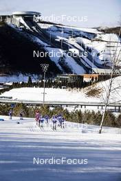 05.02.2022, Beijing, China (CHN): A scenic view of the ski jumping stadium in Zhangjiakou while the leading group is approaching   - XXIV. Olympic Winter Games Beijing 2022, cross-country, skiathlon women, Beijing (CHN). www.nordicfocus.com. © Modica/NordicFocus. Every downloaded picture is fee-liable.