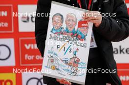12.03.2022, Schonach, Germany (GER): Cartoon by Thomas Zipfel for the FIS members for longterm services  - FIS world cup nordic combined men, individual gundersen HS100/10km, Schonach (GER). www.nordicfocus.com. © Volk/NordicFocus. Every downloaded picture is fee-liable.