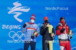 10.02.2022, Beijing, China (CHN): Joergen Graabak (NOR), Vinzenz Geiger (GER), Lukas Greiderer (AUT), (l-r) - XXIV. Olympic Winter Games Beijing 2022, nordic combined men, medals, Beijing (CHN). www.nordicfocus.com. © Thibaut/NordicFocus. Every downloaded picture is fee-liable.