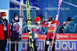 01.01.2022, Garmisch, Germany (GER): (l-r), Lovro Kos (SLO), Markus Eisenbichler (GER), Ryoyu Kobayashi (JPN) - FIS world cup ski jumping men, four hills tournament, individual HS142, Garmisch (GER). www.nordicfocus.com. © Reichert/NordicFocus. Every downloaded picture is fee-liable.