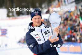 18.03.2023, Oslo, Norway (NOR): Endre Stroemsheim (NOR) presents the crystal globe for winning the IBU Cup Total Score - IBU World Cup Biathlon, cups, Oslo (NOR). www.nordicfocus.com. © Manzoni/NordicFocus. Every downloaded picture is fee-liable.