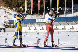 29.01.2023, Lenzerheide, Switzerland (SUI): Anton Ivarsson (SWE), Serafin Wiestner (SUI), (l-r) - IBU Open European Championships Biathlon, mixed relay, Lenzerheide (SUI). www.nordicfocus.com. © Manzoni/NordicFocus. Every downloaded picture is fee-liable.