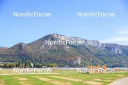 01.09.2023, Annecy, France (FRA): Event Feature: Green Weez sign with mountains as backdrop - Martin Fourcade Nordic Festival, Annecy (FRA). www.nordicfocus.com. © Manzoni/NordicFocus. Every downloaded picture is fee-liable.
