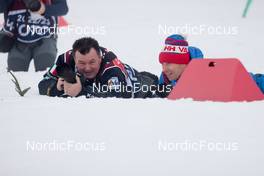 12.02.2023, Oberhof, Germany (GER): Event Feature: Photographers hide behind the v-boards - IBU World Championships Biathlon, pursuit women, Oberhof (GER). www.nordicfocus.com. © Manzoni/NordicFocus. Every downloaded picture is fee-liable.