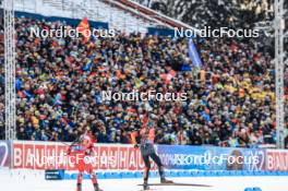 25.11.2023, Oestersund, Sweden, (SWE): Simon Eder (AUT), Justus Strelow (GER), (l-r) - IBU World Cup Biathlon, single mixed relay, Oestersund (SWE). www.nordicfocus.com. © Manzoni/NordicFocus. Every downloaded picture is fee-liable.