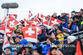 15.12.2023, Lenzerheide, Switzerland (SUI): Event Feature: Fans with Swiss flags on the grandstand - IBU World Cup Biathlon, sprint men, Lenzerheide (SUI). www.nordicfocus.com. © Manzoni/NordicFocus. Every downloaded picture is fee-liable.