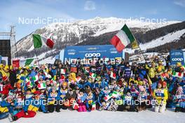22.01.2023, Livigno, Italy (ITA): Federico Pellegrino (ITA) and Francesco De Fabiani (ITA) with the Italian Team Staff and their fans (Chicco Pellegrino Official Fan Club) (l-r)  - FIS world cup cross-country, team sprint, Livigno (ITA). www.nordicfocus.com. © Modica/NordicFocus. Every downloaded picture is fee-liable.