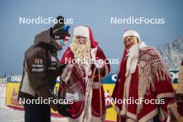 26.11.2023, Ruka, Finland (FIN): Federico Pellegrino (ITA) with Santa Claus - FIS world cup cross-country, mass, Ruka (FIN). www.nordicfocus.com. © Modica/NordicFocus. Every downloaded picture is fee-liable.