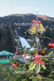 01.01.2023, Ljubno, Slovenia (SLO): Event Feature: View to the hill through a Christmas Tree - FIS world cup ski jumping women, individual HS94, Ljubno (SLO). www.nordicfocus.com. © Manzoni/NordicFocus. Every downloaded picture is fee-liable.