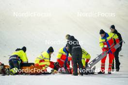 15.12.2023, Engelberg, Switzerland (SUI): Anna Odine Stroem (NOR) getting help from the paramedics - FIS world cup ski jumping women, individual HS140, Engelberg (SUI). www.nordicfocus.com. © Thibaut/NordicFocus. Every downloaded picture is fee-liable