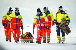 15.12.2023, Engelberg, Switzerland (SUI): Anna Odine Stroem (NOR) getting help from the paramedics - FIS world cup ski jumping women, individual HS140, Engelberg (SUI). www.nordicfocus.com. © Thibaut/NordicFocus. Every downloaded picture is fee-liable