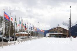 12.03.2024, Canmore, Canada (CAN): Event Feature: view to the media center building with flags - IBU World Cup Biathlon, training, Canmore (CAN). www.nordicfocus.com. © Manzoni/NordicFocus. Every downloaded picture is fee-liable.