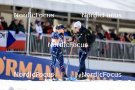 18.02.2024, Nove Mesto na Morave, Czechia (CZE): Sophie Chauveau (FRA), Cyril Burdet (FRA), coach Team France, (l-r) - IBU World Championships Biathlon, mass women, Nove Mesto na Morave (CZE). www.nordicfocus.com. © Manzoni/NordicFocus. Every downloaded picture is fee-liable.