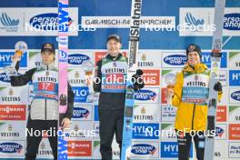 01.01.2024, Garmisch, Germany (GER): Ryoyu Kobayashi (JPN), Anze Lanisek (SLO), Andreas Wellinger (GER), (l-r) - FIS world cup ski jumping men, four hills tournament, individual HS142, Garmisch (GER). www.nordicfocus.com. © Reichert/NordicFocus. Every downloaded picture is fee-liable.