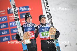 13.01.2024, Wisla, Poland (POL): Lovro Kos (SLO), Anze Lanisek (SLO), (l-r) - FIS world cup ski jumping men, super team HS140, Wisla (POL). www.nordicfocus.com. © Reichert/NordicFocus. Every downloaded picture is fee-liable.
