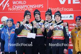 26.01.2024, Bad Mitterndorf, Germany (GER): Lovro Kos (SLO), Peter Prevc (SLO), Domen Prevc (SLO), Timi Zajc (SLO), (l-r) - FIS world championships ski flying men, medals, Bad Mitterndorf (GER). www.nordicfocus.com. © Thibaut/NordicFocus. Every downloaded picture is fee-liable.