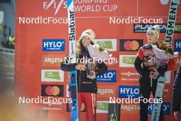 21.03.2024, Planica, Slovenia (SLO): Alexandria Loutitt (CAN), Eva Pinkelnig (AUT), (l-r) - FIS world cup ski flying women, individual HS102, Planica (SLO). www.nordicfocus.com. © Reichert/NordicFocus. Every downloaded picture is fee-liable.
